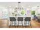 Bright, renovated kitchen featuring a large island, modern lighting, and stainless steel appliances at 2813 Hillside Rd, Smyrna, GA 30080