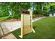 New light wood mailbox with black numbers that reads 2813, with a grassy lawn and mature trees at 2813 Hillside Rd, Smyrna, GA 30080