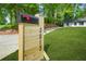 New light wood mailbox with black numbers that reads 2813, with a grassy lawn and a house in the background at 2813 Hillside Rd, Smyrna, GA 30080