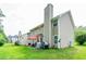 Backyard view of the home, showcasing the patio and green lawn at 5857 Cobalt Dr, Powder Springs, GA 30127