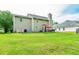 View of backyard with lush green grass and back of home at 5857 Cobalt Dr, Powder Springs, GA 30127
