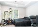 Bedroom featuring a black bed set, storage, and a window letting in light at 5857 Cobalt Dr, Powder Springs, GA 30127