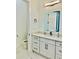 Bathroom with modern illuminated mirror, white countertops, and stylish fixtures at 2964 Old Peachtree Rd, Dacula, GA 30019