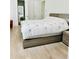 Comfortable bedroom with light wood floors, neutral colors, and contemporary furniture at 2964 Old Peachtree Rd, Dacula, GA 30019