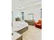 Well-lit bedroom with large windows, wood floors, and modern furnishings at 2964 Old Peachtree Rd, Dacula, GA 30019