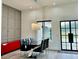 Modern dining room with elegant chandelier and eye-catching red sideboard at 2064 Old Peachtree Rd, Dacula, GA 30019