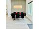 Stylish dining room featuring a contemporary chandelier and gray paneled wall at 2964 Old Peachtree Rd, Dacula, GA 30019