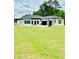 Beautiful one-story home with well-manicured lawn and a three-car garage at 2964 Old Peachtree Rd, Dacula, GA 30019