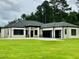 Modern home with a three-car garage and well-maintained lawn at 2064 Old Peachtree Rd, Dacula, GA 30019