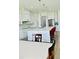 Spacious kitchen with large island, quartz countertops, and stainless steel appliances at 2964 Old Peachtree Rd, Dacula, GA 30019