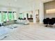 Open-concept living area with modern furniture, dining space, and view to kitchen at 2964 Old Peachtree Rd, Dacula, GA 30019