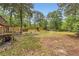 Expansive backyard with grassy areas, mature trees, and fence providing ample outdoor space at 263 Lynn Dr, Fayetteville, GA 30215