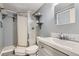 Bathroom featuring a glass-enclosed shower, modern sink and toilet at 263 Lynn Dr, Fayetteville, GA 30215