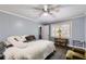 Bright bedroom with a neutral color scheme, ceiling fan, and plenty of natural light at 263 Lynn Dr, Fayetteville, GA 30215