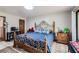 Comfortable bedroom with decorative metal bed frame, desk area and neutral colors at 263 Lynn Dr, Fayetteville, GA 30215