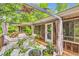Outdoor deck and pergola featuring stylish patio furniture, plants, and an inviting ambiance at 263 Lynn Dr, Fayetteville, GA 30215