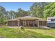 Cozy wooded home with a covered carport and ample parking for an RV or recreational vehicle at 263 Lynn Dr, Fayetteville, GA 30215