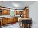 Inviting kitchen with wooden cabinets, modern appliances, breakfast bar, and durable wood-look flooring at 263 Lynn Dr, Fayetteville, GA 30215