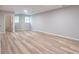 Spacious finished basement with wood grain vinyl flooring, recessed lighting, and a full bathroom at 5139 Coolamber Dr, Powder Springs, GA 30127
