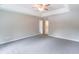 This large bedroom features neutral paint and carpeted floors and has an en-suite bathroom at 5139 Coolamber Dr, Powder Springs, GA 30127