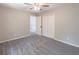 Comfortable bedroom with gray carpet, neutral paint, ceiling fan, closet, and view to second floor at 5139 Coolamber Dr, Powder Springs, GA 30127