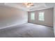 This large bedroom features neutral paint and carpeted floors and is illuminated by natural light at 5139 Coolamber Dr, Powder Springs, GA 30127