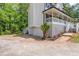 Side view of home featuring a two-car garage, stairs, and porch at 5139 Coolamber Dr, Powder Springs, GA 30127