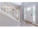 Bright entryway featuring hardwood floors and a staircase at 5139 Coolamber Dr, Powder Springs, GA 30127