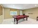 Basement with a pool table and tiled floors, great for entertaining guests at 6990 N Glen Dr, Cumming, GA 30028
