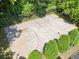 Outdoor basketball court surrounded by lush greenery, offering a space for recreational sports and exercise at 6990 N Glen Dr, Cumming, GA 30028