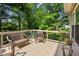 Enjoy the outdoors on this deck surrounded by a wooded view at 6990 N Glen Dr, Cumming, GA 30028