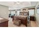 Spacious main bedroom with tray ceiling, plush carpets, and a sitting area at 6990 N Glen Dr, Cumming, GA 30028