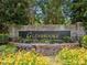 Welcoming Glenbrooke community sign surrounded by flowers and greenery at 6990 N Glen Dr, Cumming, GA 30028