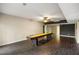 Finished basement featuring wood look tile floors and a shuffleboard table at 2912 Dunhill Trl, Woodstock, GA 30189