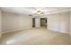 Large finished basement area with carpet flooring and access to other rooms at 2912 Dunhill Trl, Woodstock, GA 30189