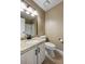 Bathroom with granite countertop vanity, framed mirror, and a tiled floor at 2912 Dunhill Trl, Woodstock, GA 30189