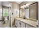Full bathroom with a tiled floor, granite countertop, framed mirror and a shower/tub combo at 2912 Dunhill Trl, Woodstock, GA 30189