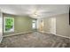 Spacious bedroom with a ceiling fan and two bright windows that provide natural light at 2912 Dunhill Trl, Woodstock, GA 30189