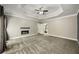 Large bedroom featuring a tray ceiling, fireplace and view of the en suite bathroom at 2912 Dunhill Trl, Woodstock, GA 30189