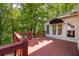 Inviting wooden deck area surrounded by lush greenery, offering a peaceful outdoor retreat at 2912 Dunhill Trl, Woodstock, GA 30189
