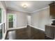 Open Dining Room features hardwood floors, natural light, and a neutral color palette at 2912 Dunhill Trl, Woodstock, GA 30189