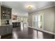 The dining room includes a breakfast bar, hardwood floors, natural light, and access to the kitchen at 2912 Dunhill Trl, Woodstock, GA 30189