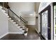 Elegant foyer with stained glass front door, staircase with iron balusters, and hardwood floors at 2912 Dunhill Trl, Woodstock, GA 30189