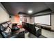 Finished basement home theater featuring tiered seating and a large projection screen at 2912 Dunhill Trl, Woodstock, GA 30189