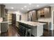 Spacious kitchen boasts a large island, stainless steel appliances, seating and custom cabinets at 2912 Dunhill Trl, Woodstock, GA 30189