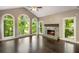 Bright living room features a vaulted ceiling, large windows with natural light and a stone fireplace at 2912 Dunhill Trl, Woodstock, GA 30189
