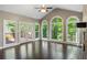 Living room boasts a fireplace, hardwood floors, natural light, and access to the outside deck at 2912 Dunhill Trl, Woodstock, GA 30189