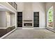 Bright living room featuring a fireplace, built-in shelves, and large window at 2912 Dunhill Trl, Woodstock, GA 30189