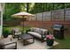 Outdoor patio space with comfortable seating, umbrella, grill, perfect for relaxing and entertaining in style at 3315 Haverhill Rowe, Lawrenceville, GA 30044