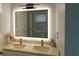 Modern bathroom featuring double sink vanity with quartz countertops and illuminated mirror at 3315 Haverhill Rowe, Lawrenceville, GA 30044